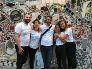 Art-Reach Staff Posing Together at Philadelphias Magic Gardens in matching Art-Reach Shirts