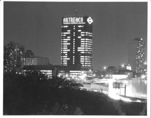 "Art Reach" projected on the screen of a building on the Philadelphia skyline, 1993