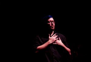 A man performs ASL interpretation at Art-Reach's Martha Graham All-Access show at FringeArts.