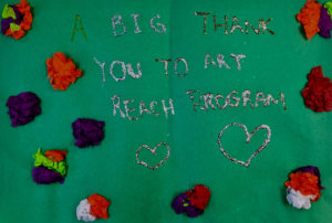 Green thank you card reads, "A big thank you to art reach program."