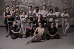 ST Kats Day School & PA Ballet II Group Photo. All are posing by around a ballet bar in the Studio